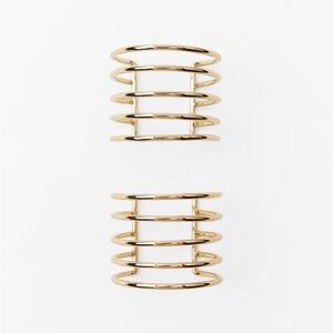 NWT. Zara Golden Pack of Two Metal Rigid Striped Armbands.